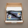 Custom Bluey tennis shoes for kids displayed on a light wooden floor next to colorful playground toys and blocks