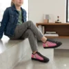 Detailed close up of custom pastel Bluey converse style shoes for active girls