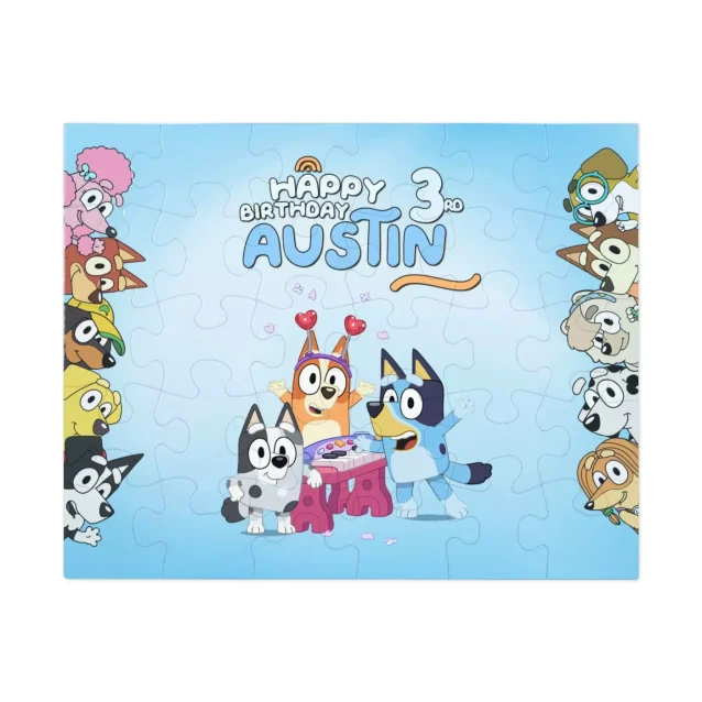 A young child's hands placing a piece into the Bluey wooden puzzle.