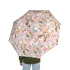 Bluey Christmas umbrella being used on a sunny day, highlighting UV protection.