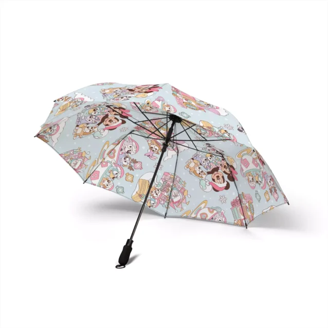 The soft foam handle of the Bluey Christmas umbrella, held in one hand.