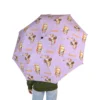 The Bluey umbrella standing open to dry after a downpour.