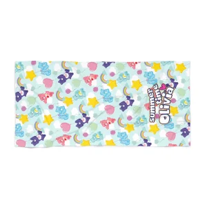 A soft beach towel featuring the colorful Care Bears, perfect for personalization.