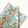 Garfield napping on a stack of presents wrapped in Garfield gift wrap.
