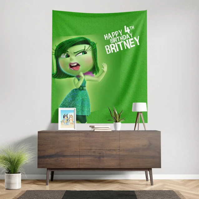 Disgust, the sassy green character with purple hair from Disney Pixar's Inside Out, on a birthday banner ready to add some fun (and maybe a little grossness) to the party.