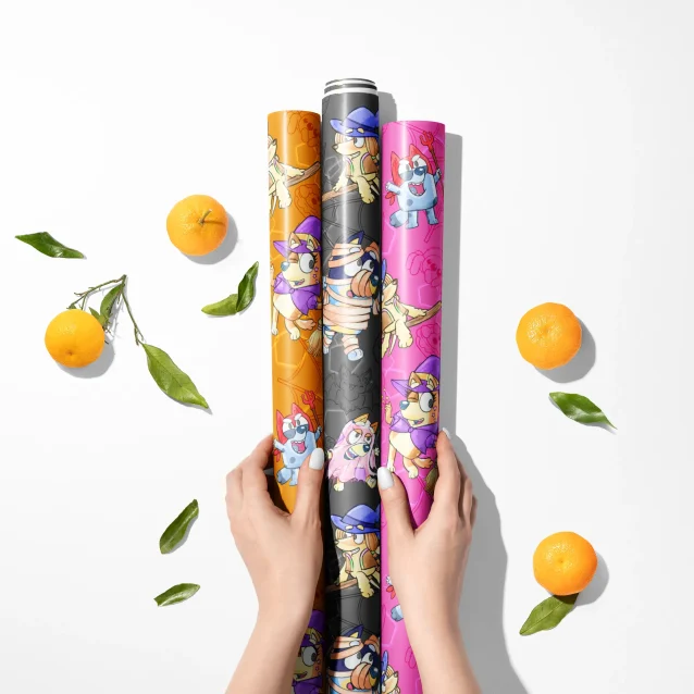 Spooky and playful Halloween wrapping paper with Bluey.