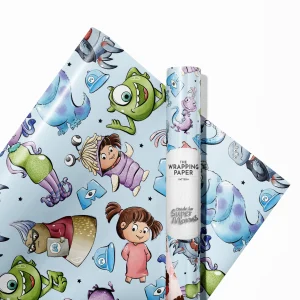 Child happily holding a present wrapped in Monsters Inc birthday paper.