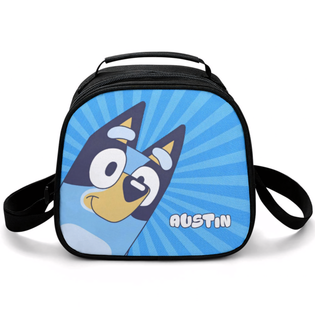 Personalized Bluey lunch bag in the Bluey Close-Up design — Bluey's face filling the front panel on a blue starburst, with the child's name printed beside her, and an adjustable shoulder strap.