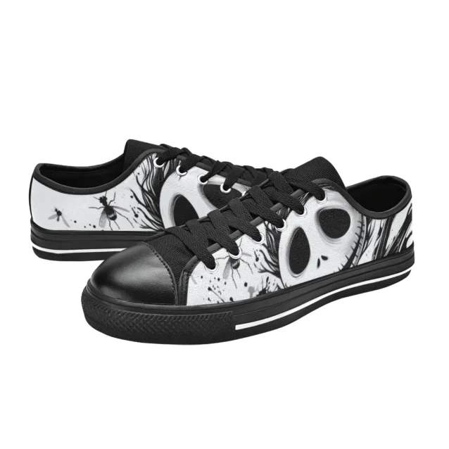 Close-up of the bat bowtie and skull graphics on the Jack Skellington low top sneakers.