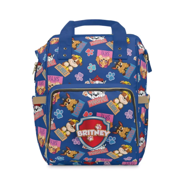 Navy Paw Patrol nappy bag with the rescue pups, "PAW" comic art and flowers.