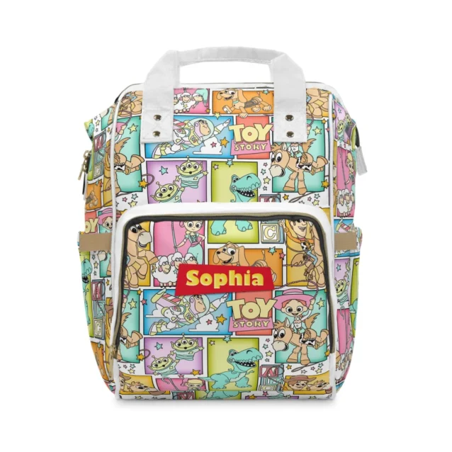 Side profile of the custom Toy Story changing bag showing the convenient elastic baby wipe-dispenser pocket.