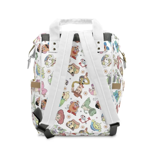 Organized interior view of the Pixar changing bag showing elastic wall pockets holding wipes, creams, and lotions.