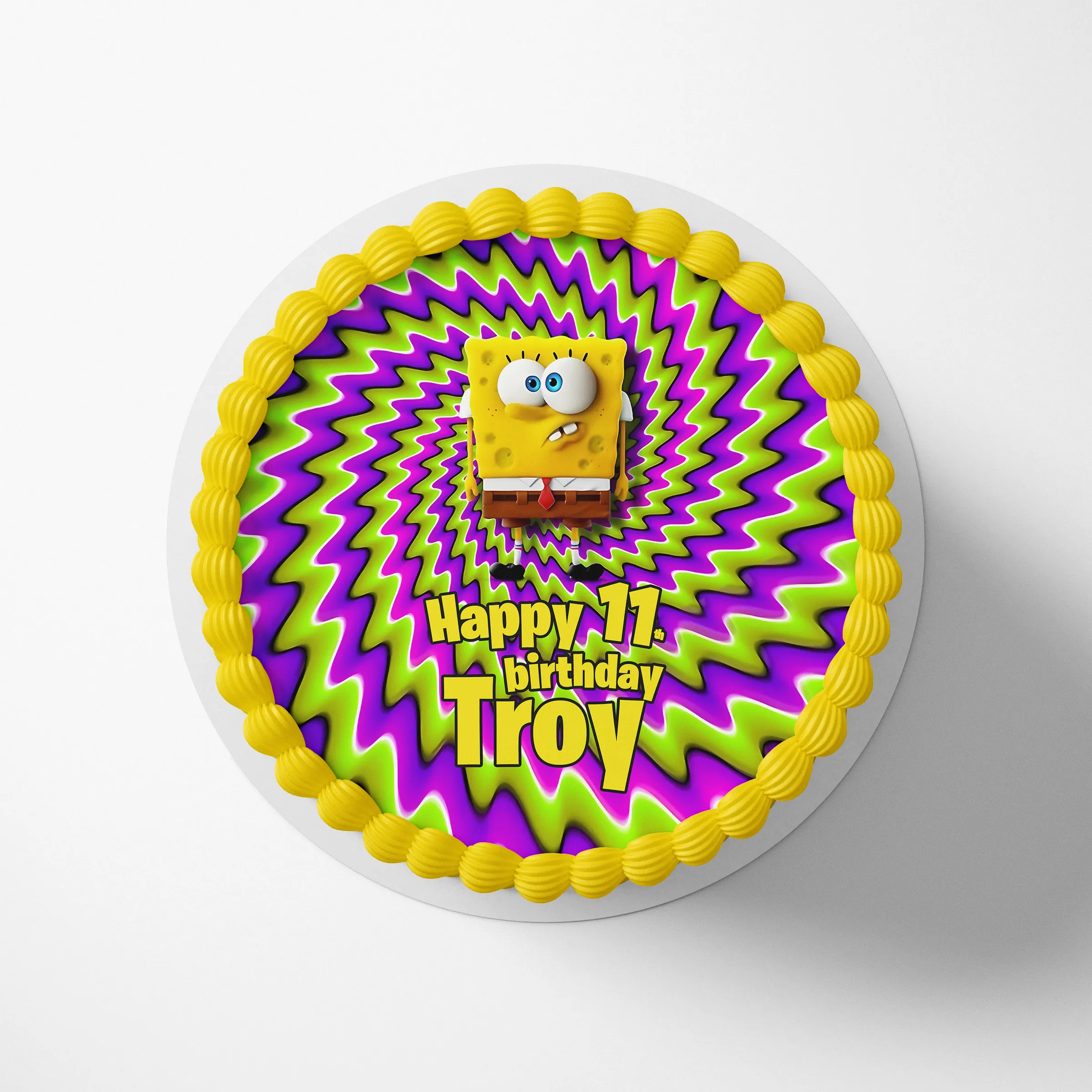 Personalized SpongeBob cake topper on a round birthday cake