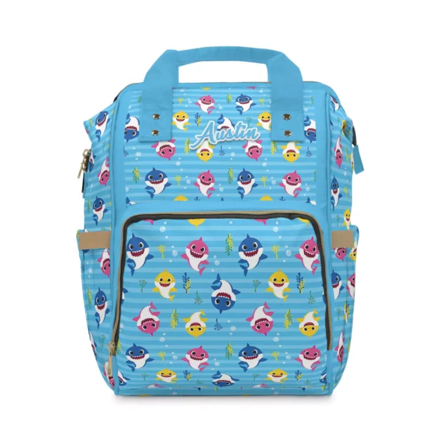 Light blue striped Baby Shark nappy bag with Daddy, Mommy and Baby Shark on a horizontal-stripe background.