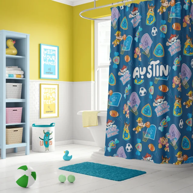Customizable Paw Patrol shower curtain displaying a child's name amidst the heroic pups design.