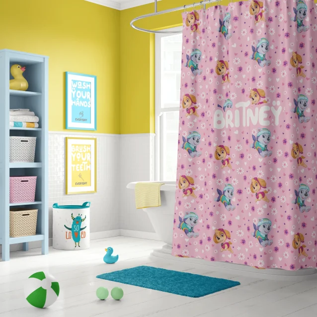 Full view of a Paw Patrol themed bathroom with the colorful shower curtain as the centerpiece.