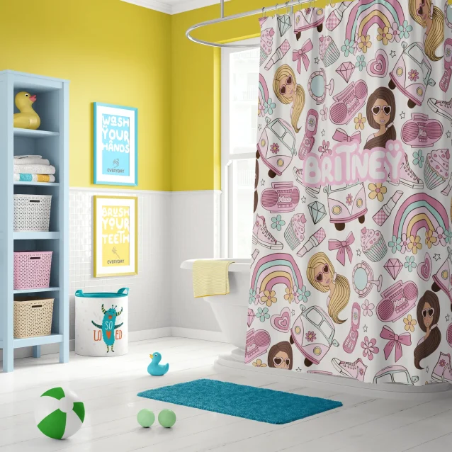 A fun kids' bathroom featuring a black and white striped Barbie shower curtain.