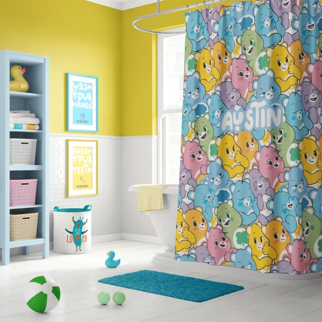 A complete Care Bears bathroom set with a shower curtain and matching bath mat.