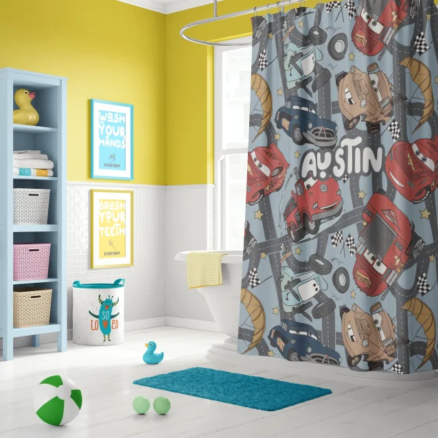 Disney Cars shower curtain with Lightning McQueen in a fun kids' bathroom.
