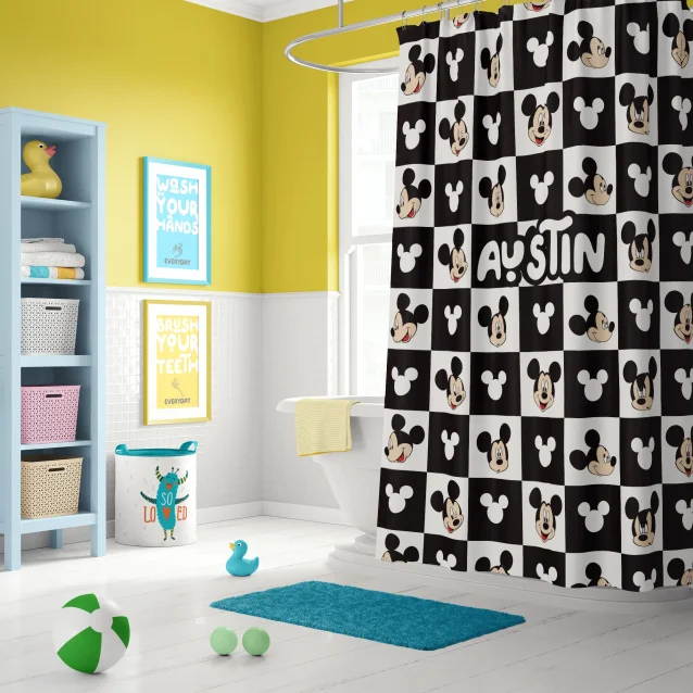 Mickey Mouse shower curtain in a fun, colorful kids' bathroom.