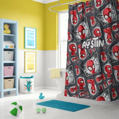 Close-up of the classic Spiderman mask on a red fabric shower curtain.