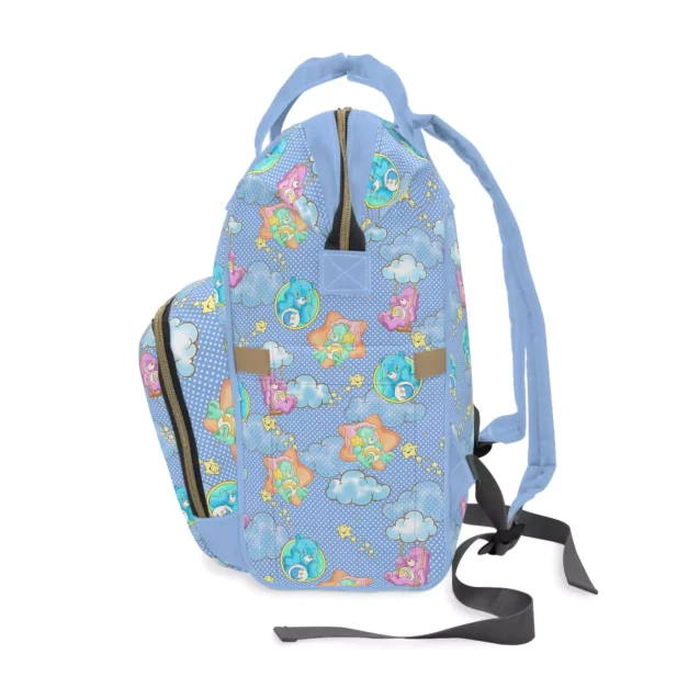 The Care Bears diaper bag hanging on a stroller, ready for an outing.