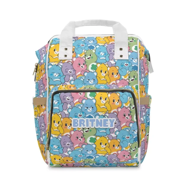 A lifestyle image of a family with the Care Bears diaper bag at the park.