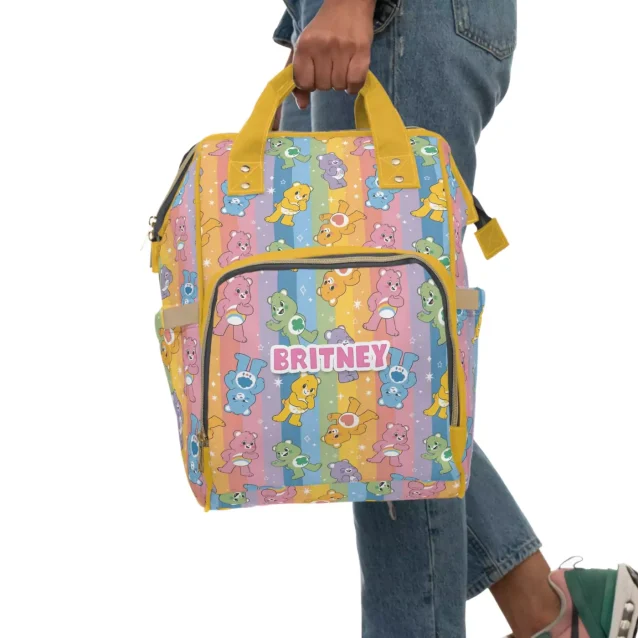 The various compartments of the Care Bears diaper bag displayed open.