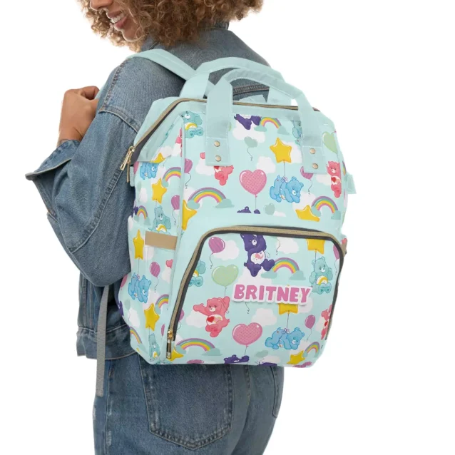 A dad comfortably wearing the Care Bears Diaper Backpack.