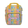 Yellow rainbow-stripe Care Bears diaper bag with the Care Bears and rainbow tummies.