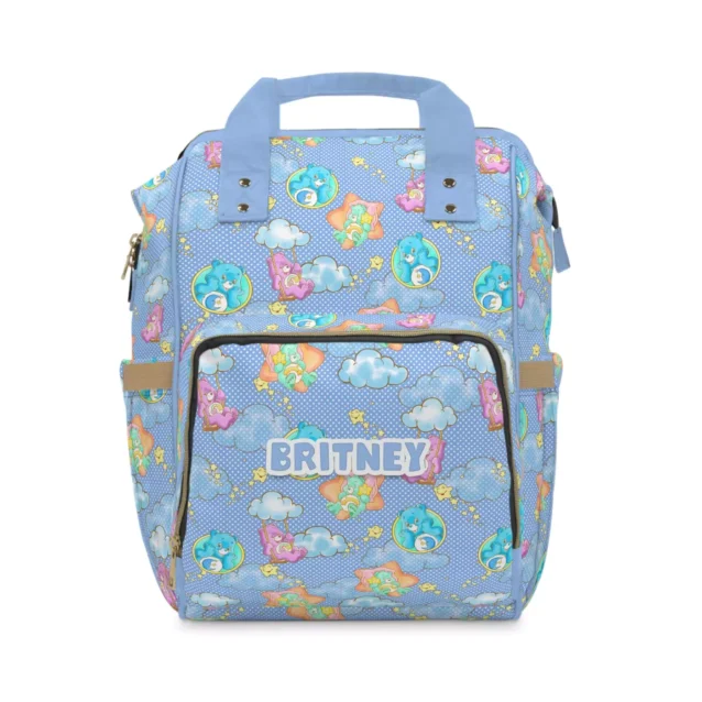 Periwinkle Care Bears diaper bag backpack with Share Bear and friends among clouds and rainbows.