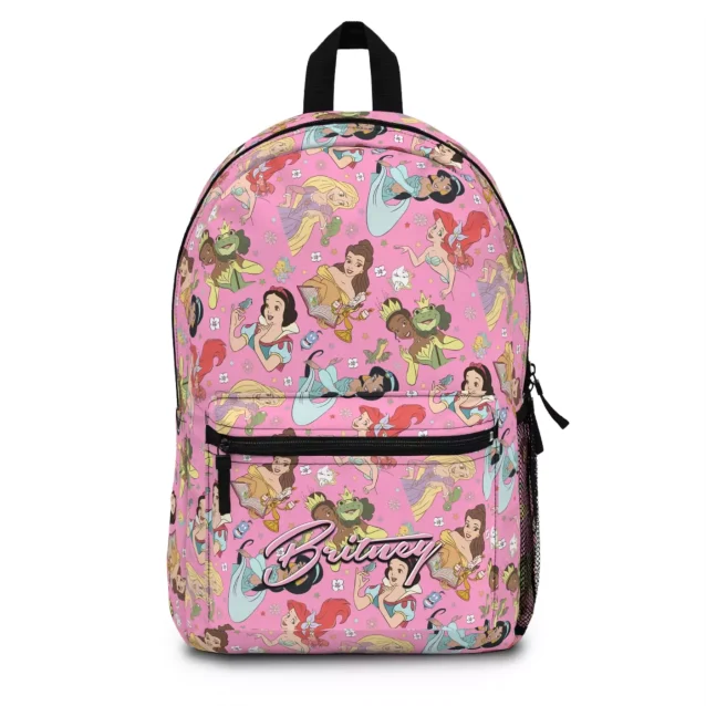 Front view of a personalized Disney Princess backpack for girls, with a pink fairytale castle pattern and a custom name.