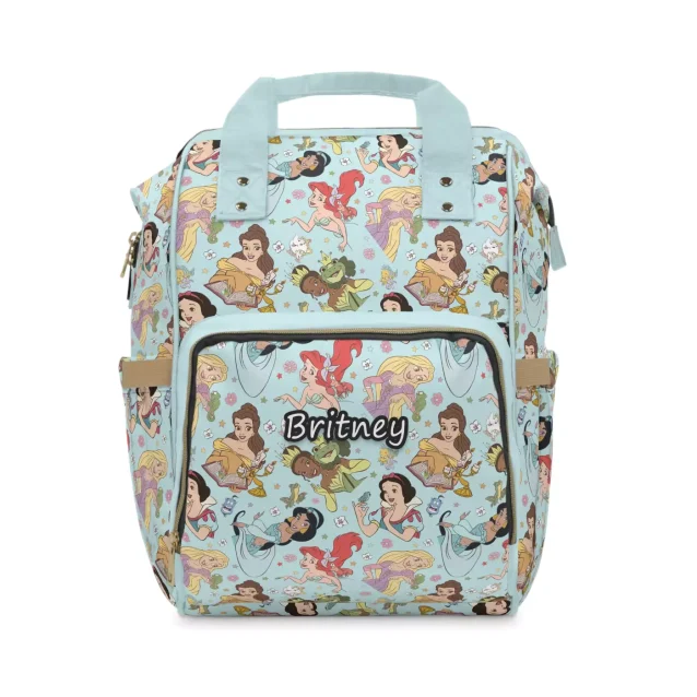 The Disney Princess Diaper Bag next to a stroller, showing its versatility.