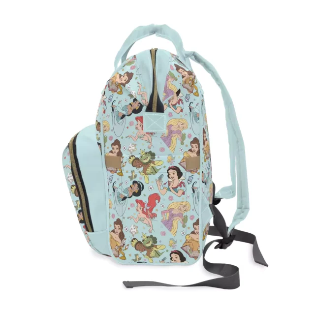 A lifestyle image of the Disney Princess Diaper Bag at a park.