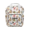 A stylish mom carrying the Disney Princess diaper bag backpack on a sunny day.