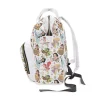 Detailed view of the three insulated bottle pockets in the front section of the diaper bag.