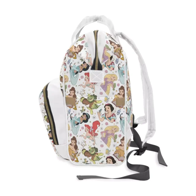 Detailed view of the three insulated bottle pockets in the front section of the diaper bag.