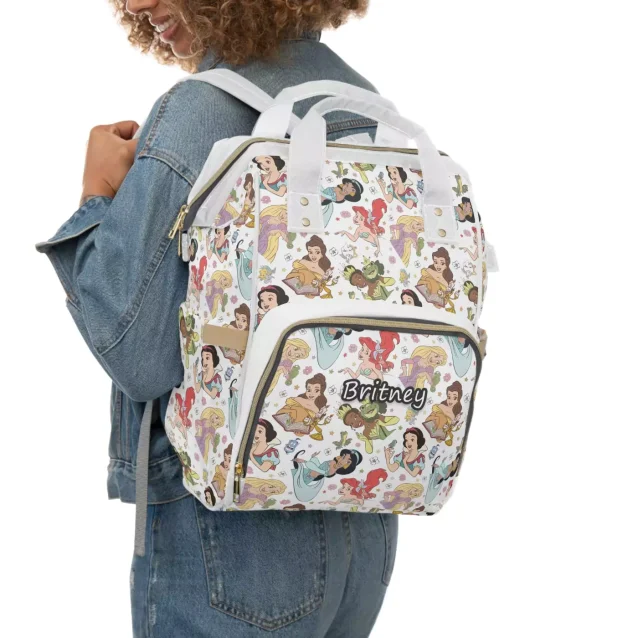 The lightweight design of the Disney Princess Diaper Bag being held with one hand.