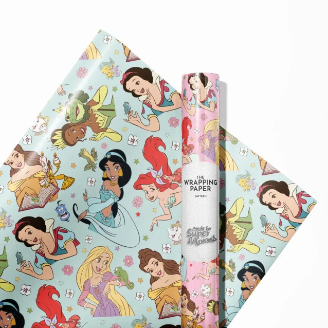 A child's hands unwrapping a gift to reveal the Disney Princess paper.