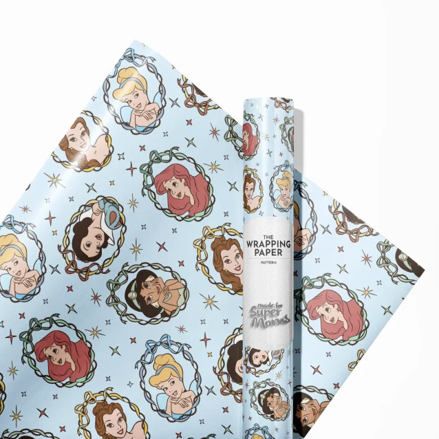 The vibrant colors of the Disney Princess wrapping paper under light.