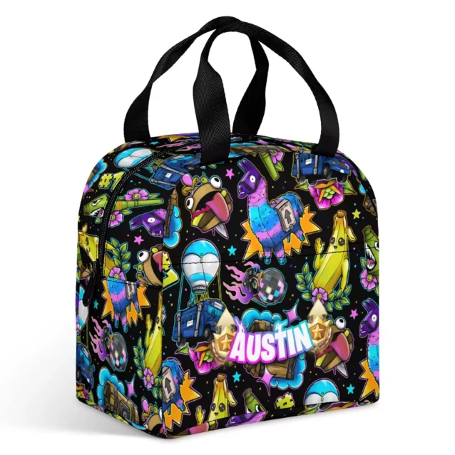 Black Fortnite meal bag covered in loot llamas, Peely bananas and battle buses, personalized with the name Austin.