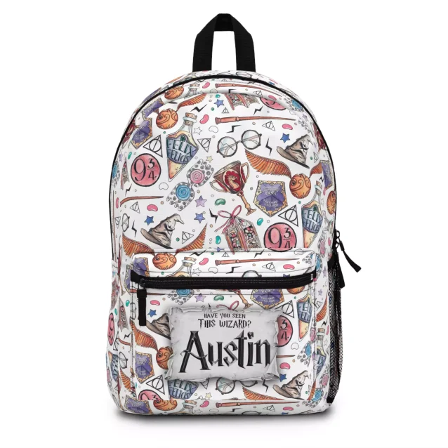Front view of a personalized Harry Potter backpack with a white magic-themed pattern, featuring a customizable 'Have you seen this wizard?' patch with the name 'Austin'.