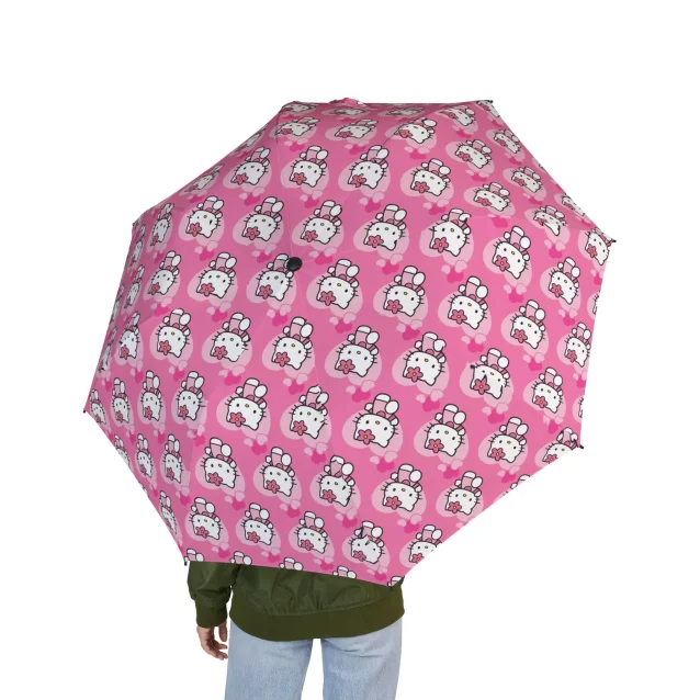 A personalized Hello Kitty umbrella with a name embroidered on the strap.