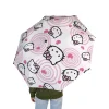 A woman holding the open Hello Kitty umbrella in the rain.