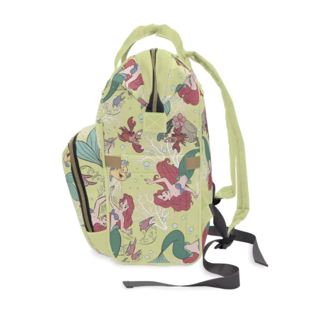 The three elastic bottle holders in the front pocket of the Little Mermaid diaper bag.