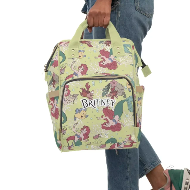 The "under the sea" themed pattern on the Little Mermaid diaper backpack.