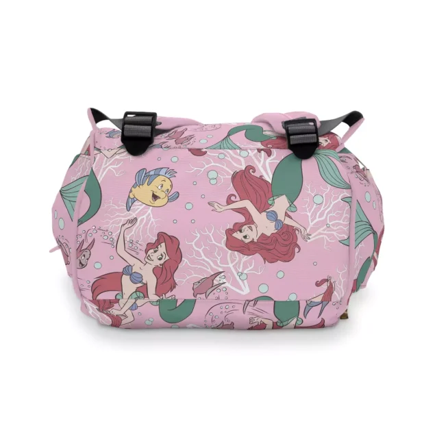 A mom easily accessing the side pocket of the Little Mermaid diaper bag.