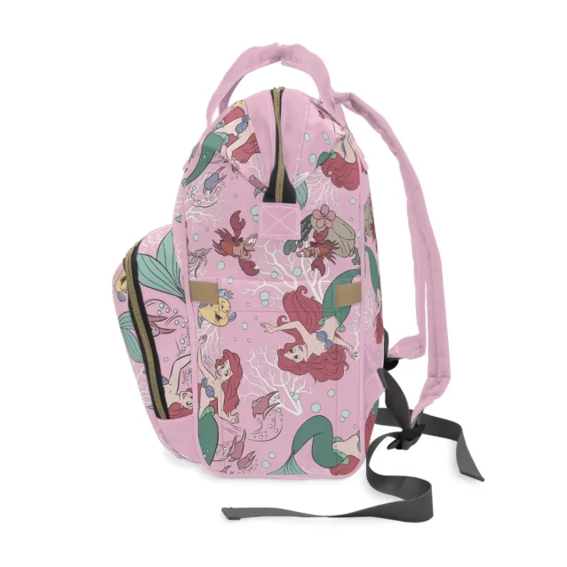 The Little Mermaid diaper backpack shown with a complete set of baby essentials.