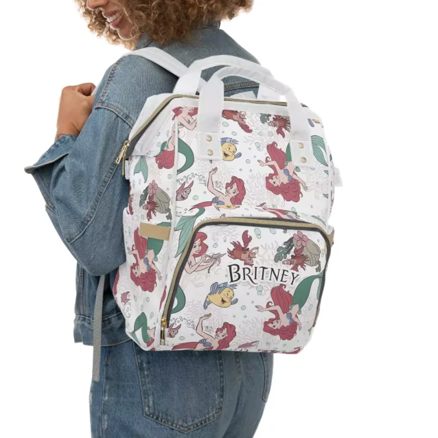 Side view of the Little Mermaid baby bag, showing the spacious side pockets.
