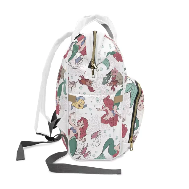 The spacious main compartment of the Little Mermaid diaper bag, open to show its depth.